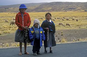 Children sell cheap jewelry on the roadside near Puno