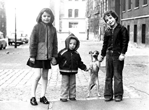 Children with small dog, ca. 1980s