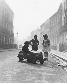Children with toy car, England, Great Britain