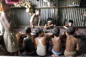 Children working on Zari embroidery in a workshop in Govandi
