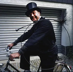 Chimney sweep in professional training and posing in a photo studio