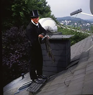 Chimney sweep in professional training and posing in a photo studio
