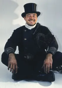 Chimney sweep in professional training and posing in a photo studio