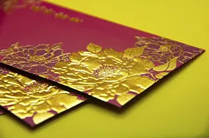 Chinese New Year golden red packets on yellow background