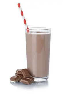 Chocolate milk shake milkshake in glass straw