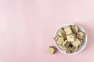 Chocolate mini waffles on a pink background