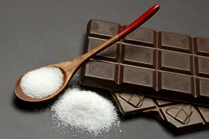 Chocolate and sugar bar in spoon