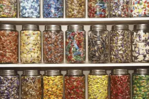 Category Historic EN Prints: Chocolates kept in different glass jars on selves in shop