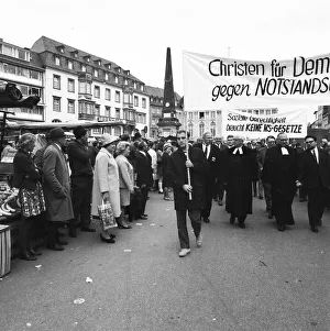 Several hundred Christians, among them church dignitaries in their robes