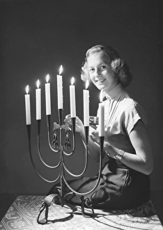 Christmas in the 1940s. Margit Sjoedin is lighting the candles at christmas