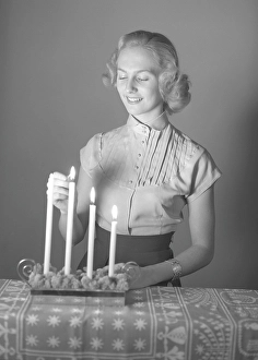 Christmas in the 1950s. Margit Sjoedin is lighting the candles at christmas