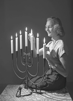 Christmas in the 1950s. Margit Sjoedin is lighting the candles at christmas