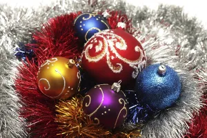 Christmas balls on abstract tinsel background