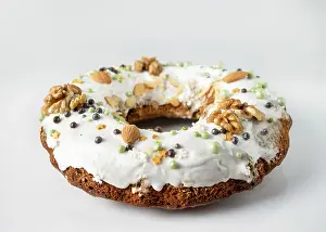 Christmas cake in sugar icing, with walnuts and almonds