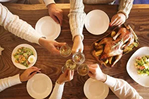 Christmas dinner with roast duck and champagne on wooden table