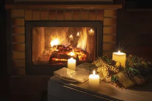 Christmas floral decoration with wafer in front of firepace