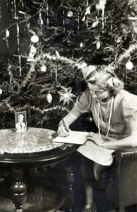 Christmas during World War II, Woman writes a letter in front of Christmas tree