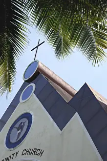 Church with a cross on top named as Holy Trinity Church at Benaulim Goa Maharashtra India Asia September 2010