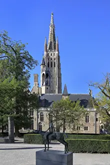 Church of Our Lady and the statue of one of the Four Horsemen of the Apocalypse