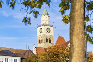 Framed Print : Church tower against blue sky with autumn leaves in the foreground