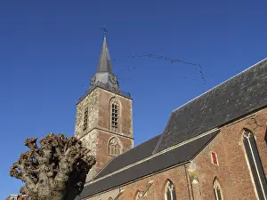 Framed Print : Church tower with a formation of flying birds in the background Framed Print : Church tower with a formation of flying birds in the background