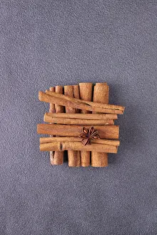 Cinnamon sticks, star anise on blue background
