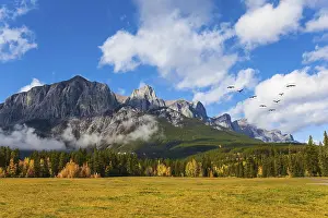 The city of Canmore is surrounded by the Rocky Mountains