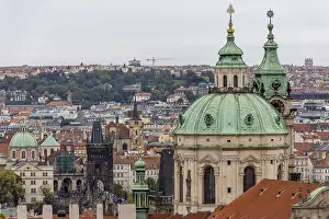 City panorama photographed from Prague Castle on Hradcany hill with the large green dome of St