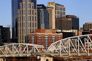 City view with skyscrapers and bridge under clear sky in Nashville