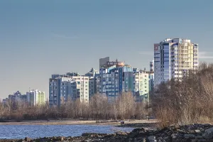 Cityscapes and skyline in clear blue sky on view from river