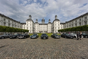 Classic Aston Martins in front of the Grandhotel Schloss Bensberg