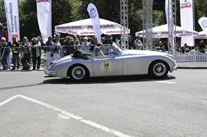 A classic convertible takes part in a classic car race