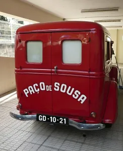 Classic red Paco de Sousa delivery van parked indoors