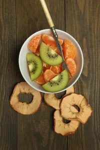 Clementine pieces and kiwi slices in peel