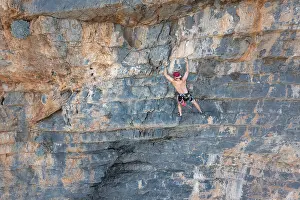 Climber climbing on a rock face