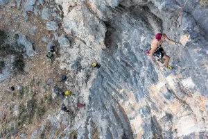 Climber climbing on a rock face