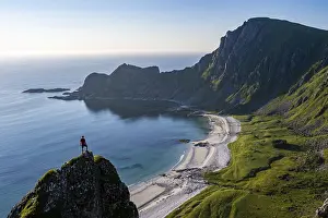 Climber on a rock, view of picturesque coastal landscape