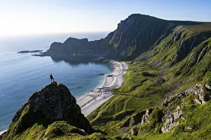 Climber on a rock, view of picturesque coastal landscape