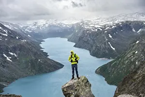 Climber standing on rocks, Besseggen hike