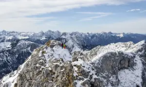 Climbers on the summit ridge, hiking to the Ammergauer Hochplatte in the Ammergau Alps in winter
