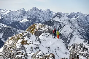 Climbers on the summit ridge, hiking to the Ammergauer Hochplatte in the Ammergau Alps in winter