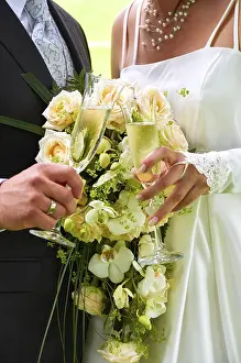 Clink glasses by bride and groom
