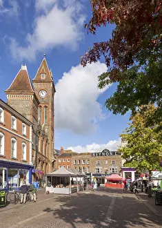 Clock tower of town hall and historic buildings in Market Place