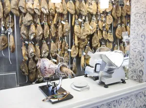 Close up display of cured hams inside a specialist shop in Barrio Macarena