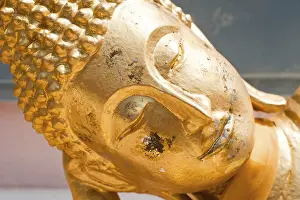 Close up face of resting Golden Buddha (Tuesday) in Wat Phra Yai Temple