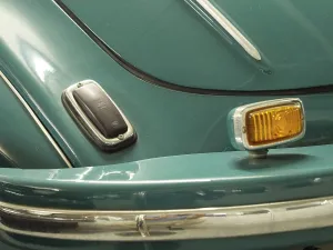Close-up of a blue bumper of a classic car