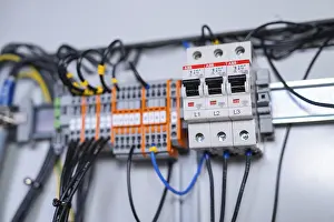 Category Historic EN Prints: Close-up of circuit-breakers and cables in an electrical system