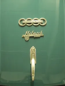 Close-up of a green Audi classic car with emblem and nostalgic design
