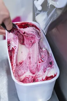 Close-up of red and white ice cream in the container