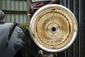 Close-up and selective focus of bright big headlight